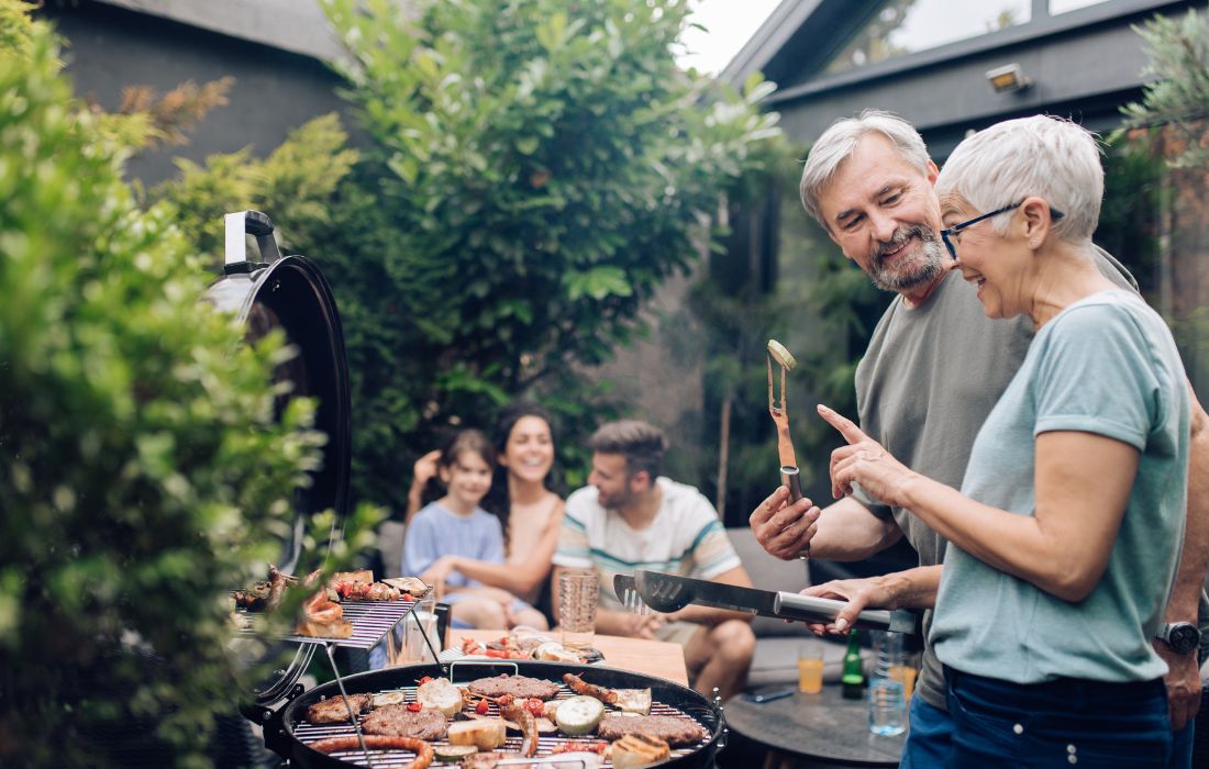 grandfather and grandmother making bbq