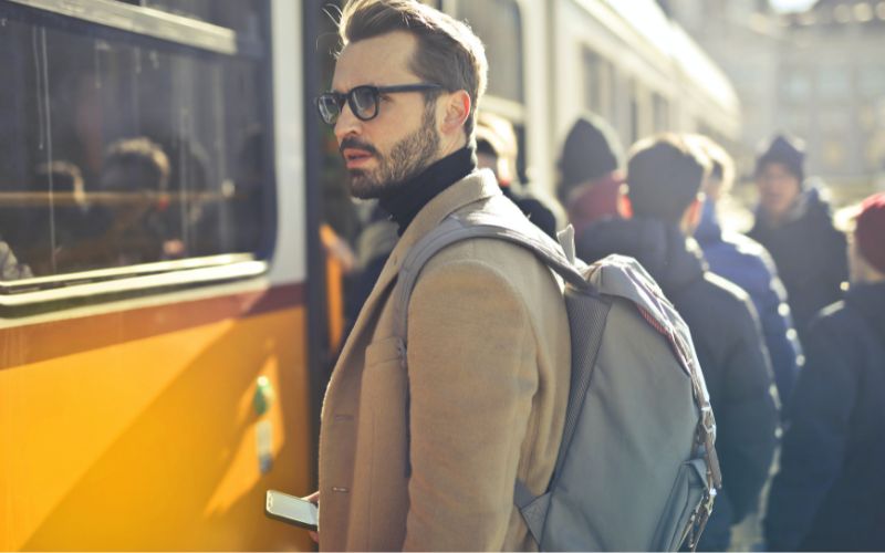 man carrying a business backpack